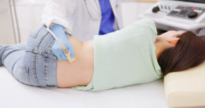 Woman kidney ultrasound examination by kidney specialist
