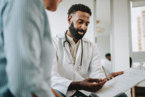The best nephrologist in the greater area of Taunton, MA, explaining test results to a patient.