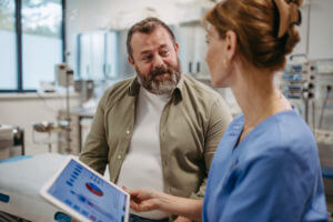 Patient talking to a doctor at a Nephrology appointment.