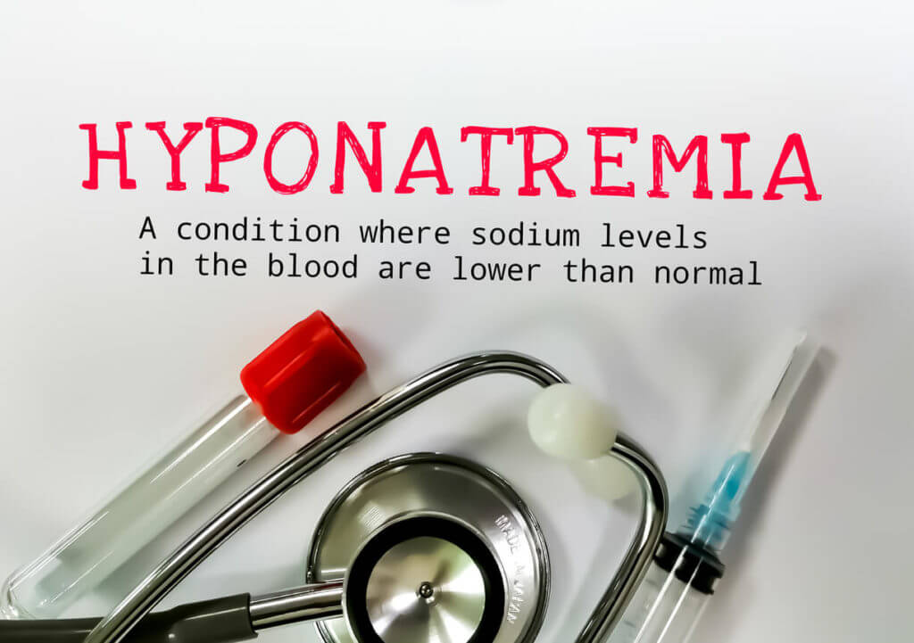 An image of a stethoscope, syringe, medical tube, and the word hyponatremia, which means low sodium levels in the blood.