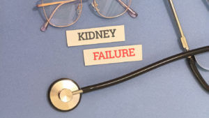 Medical concept of kidney failure with stethoscope and glasses.